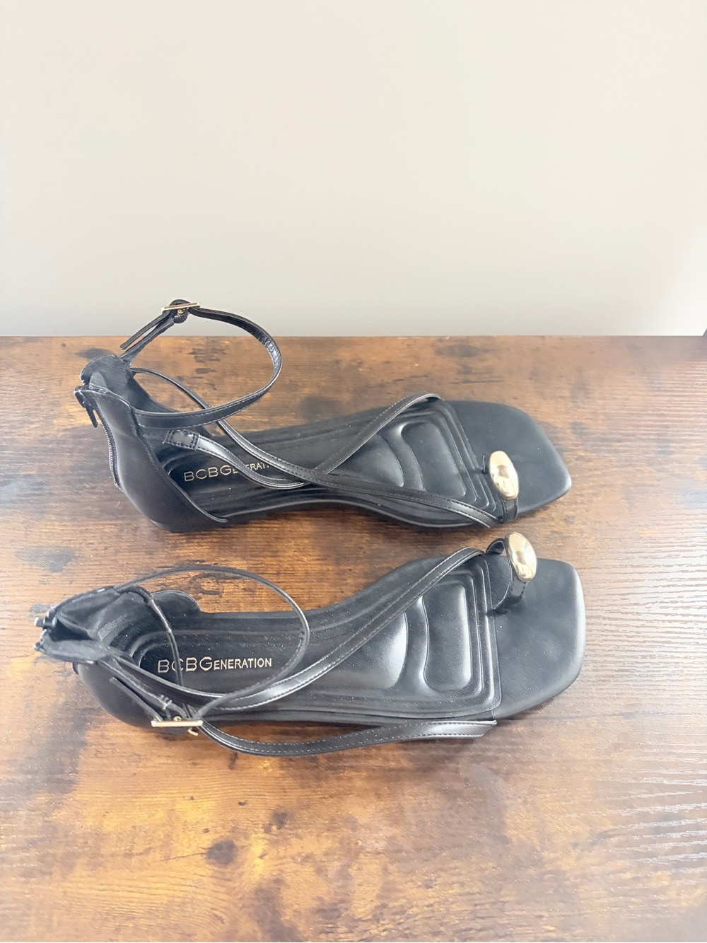 BCBGeneration Black Ankle-Strap Heeled Sandals with Gold Accent